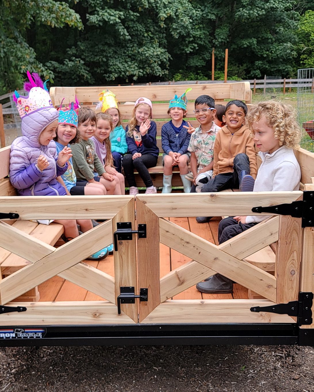 View larger image of Village Learning Child Care kids on a farm wagon ride Village Learning Child Care kids on a farm wagon ride